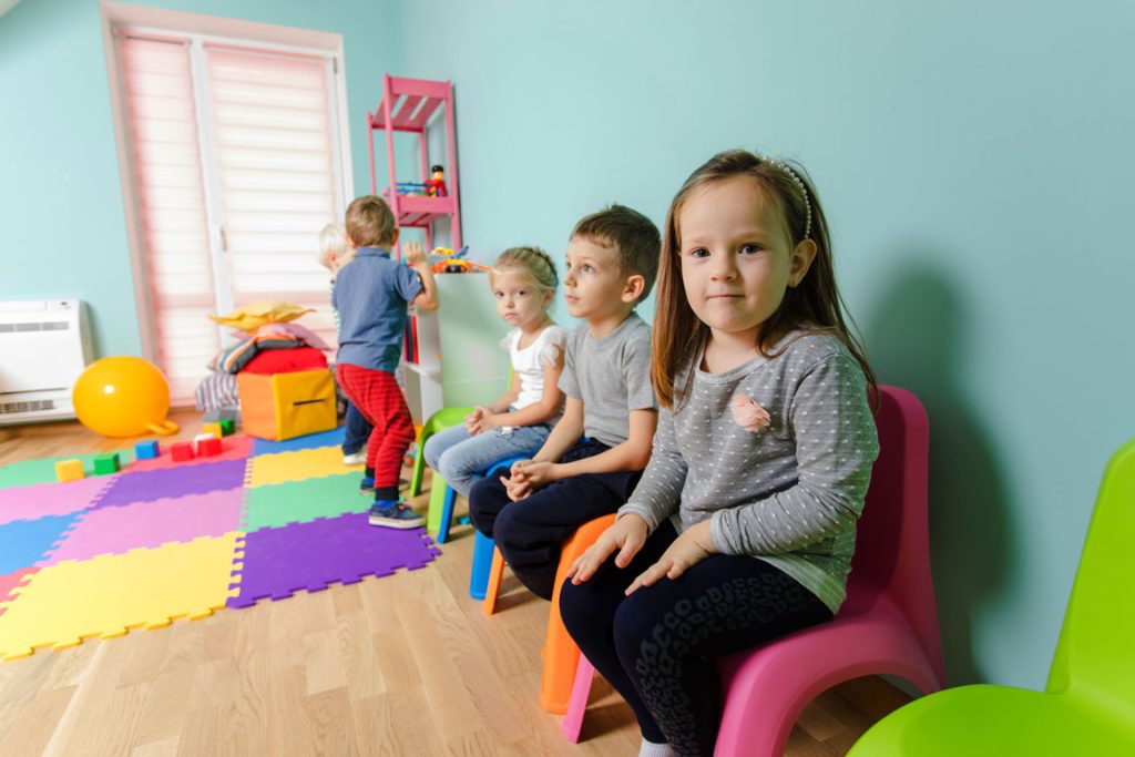 children sitting in pre k classroom